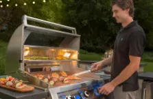 Smiling man grilling