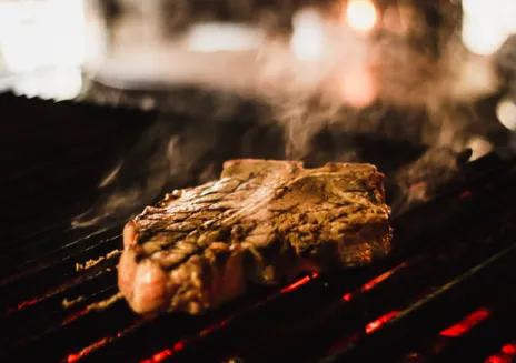 Steaming steak on a grill rack