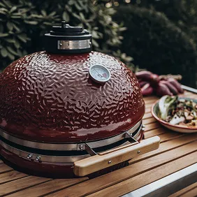 Abundantly loaded open Monolith grill with various foods