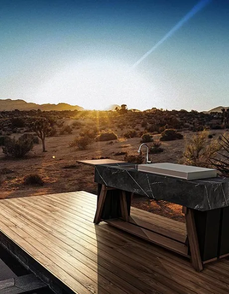 OCQ outdoor kitchen in the middle of a prairie landscape at sunset